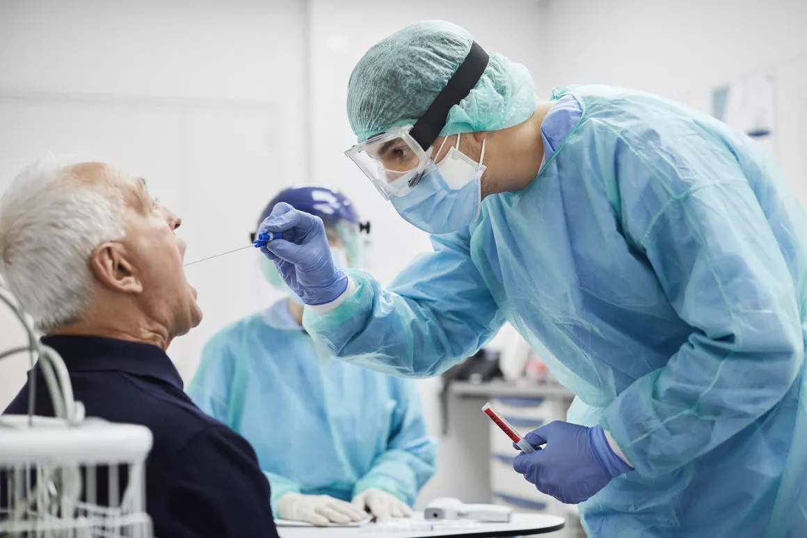 man-getting-mouth-swab-to-test